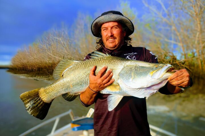 a man holding a fish