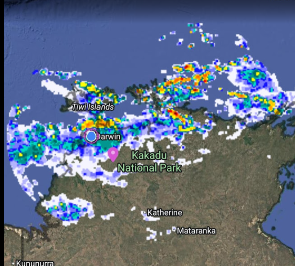 Weather radar showing rain clouds over Northern Australia, including Darwin and Kakadu National Park.