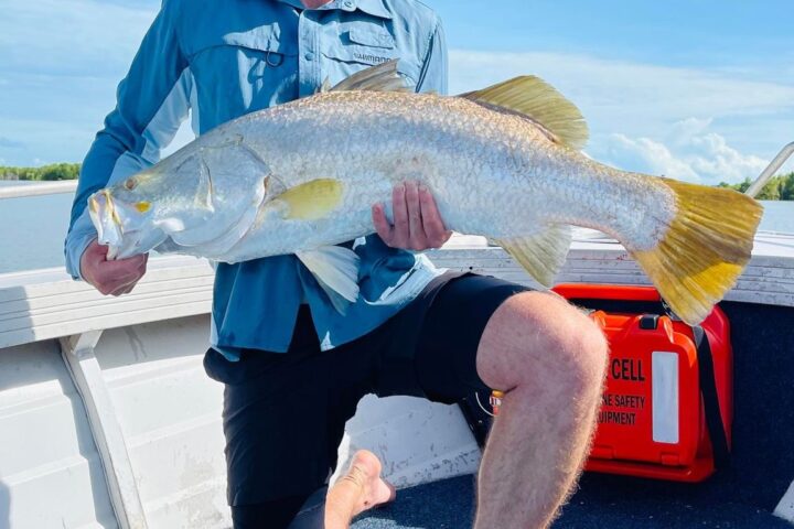 a person holding a fish